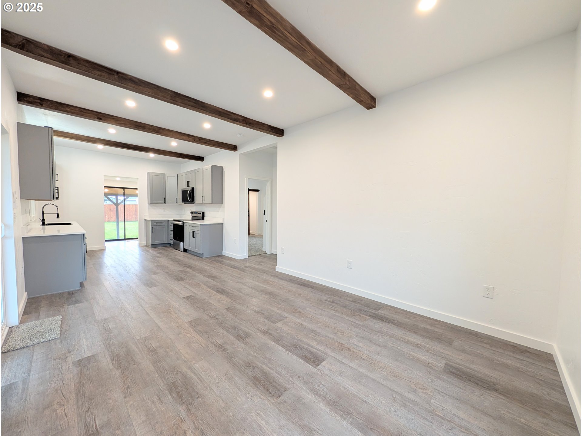 2906 North Oak Street La Grande, OR 97850 - Photo 15 of 37 a view of a kitchen with a sink and a refrigerator