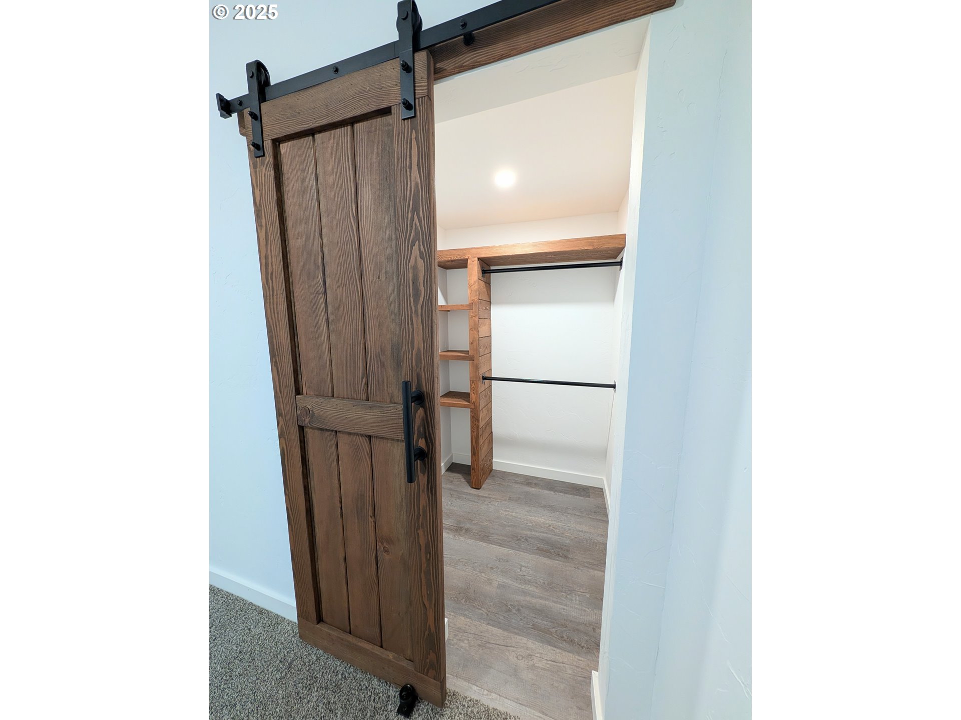 2906 North Oak Street La Grande, OR 97850 - Photo 23 of 37 a view of a hallway with wooden floor