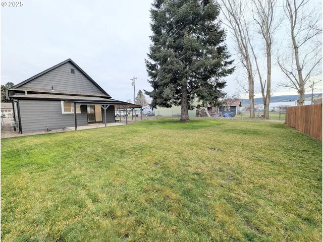 a view of backyard with green space