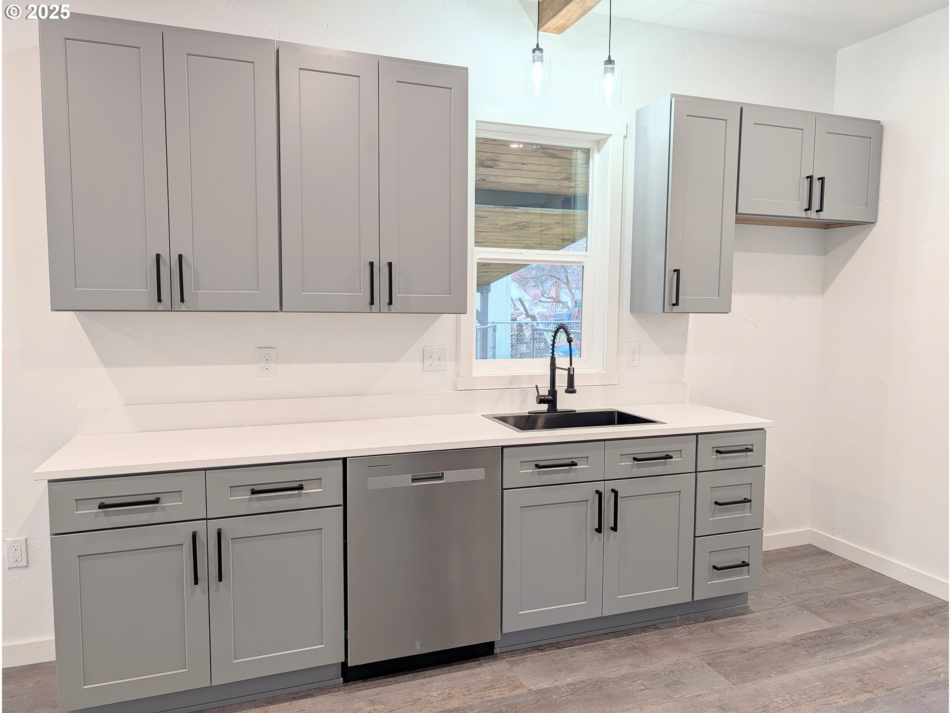2906 North Oak Street La Grande, OR 97850 - Photo 10 of 37 a kitchen with cabinets appliances and a sink