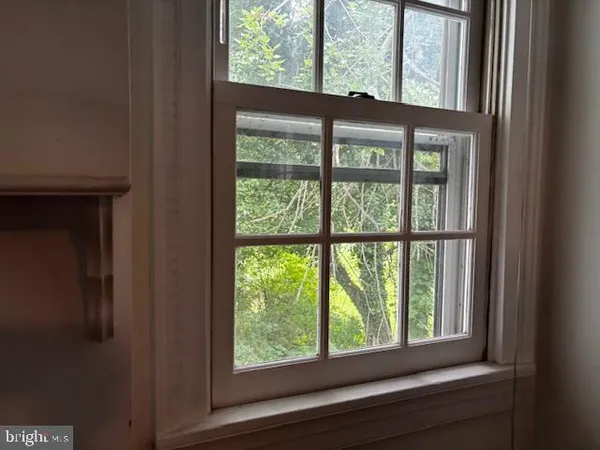 a bathroom with a sink and a window