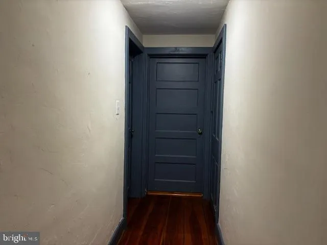 a white toilet sitting next to a sink