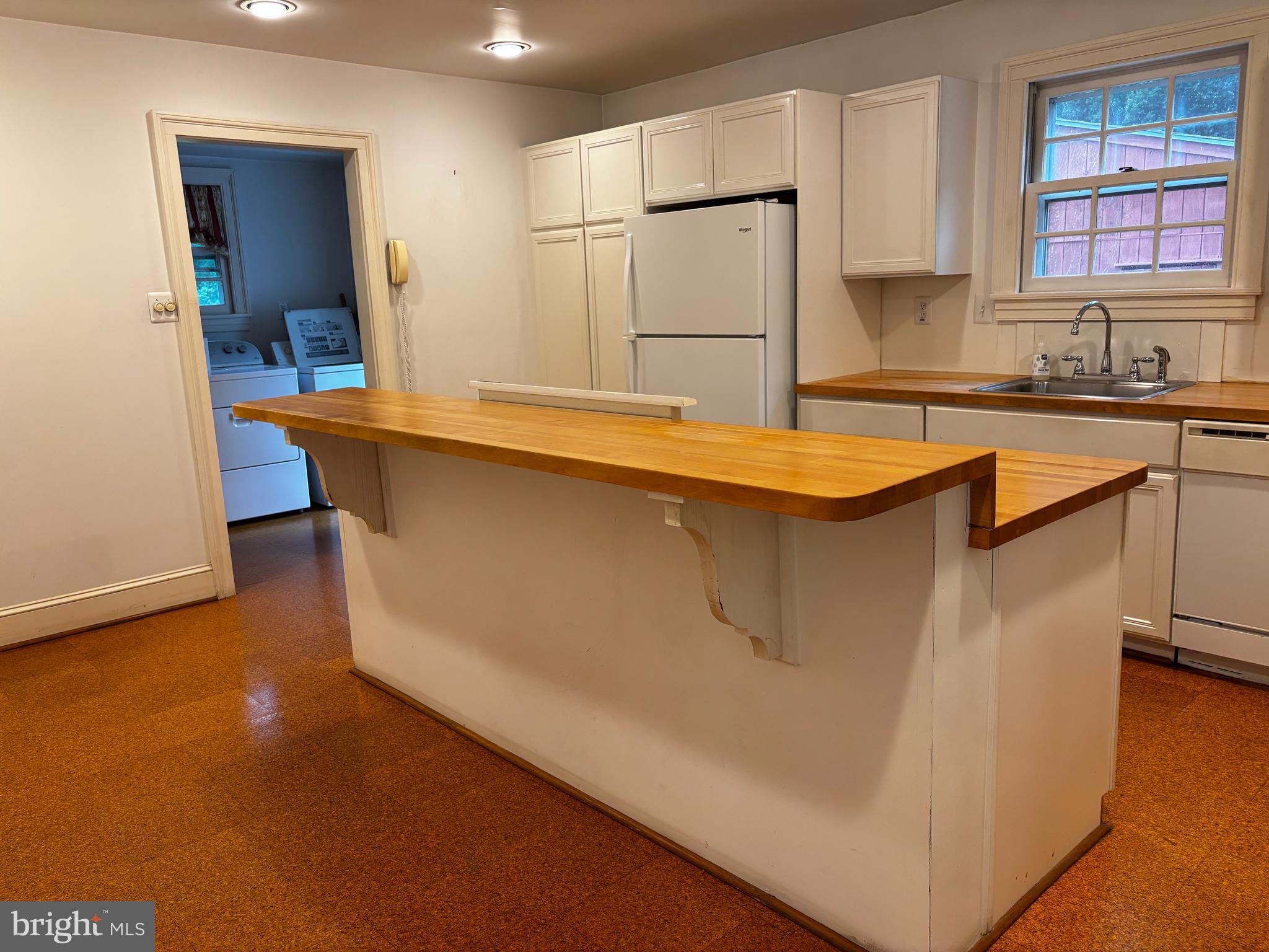 410 Wharf Road, Unit RIVER Bensalem, PA 19020 - Photo 37 of 62 a kitchen with stainless steel appliances granite countertop a sink a stove and a refrigerator
