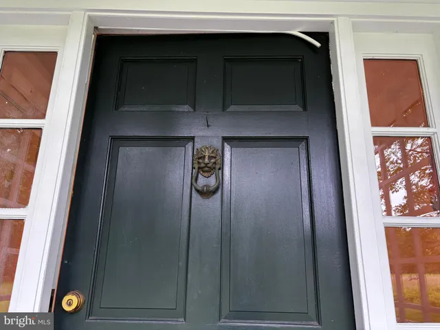 a house with a door and a mirror
