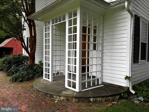 a house with a door and a mirror