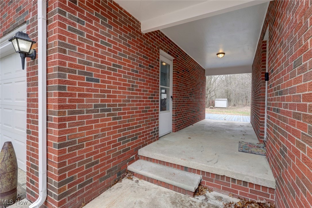 8104 Barnes Road Vermilion, OH 44089 - Photo 4 of 40 Property entrance with a porch