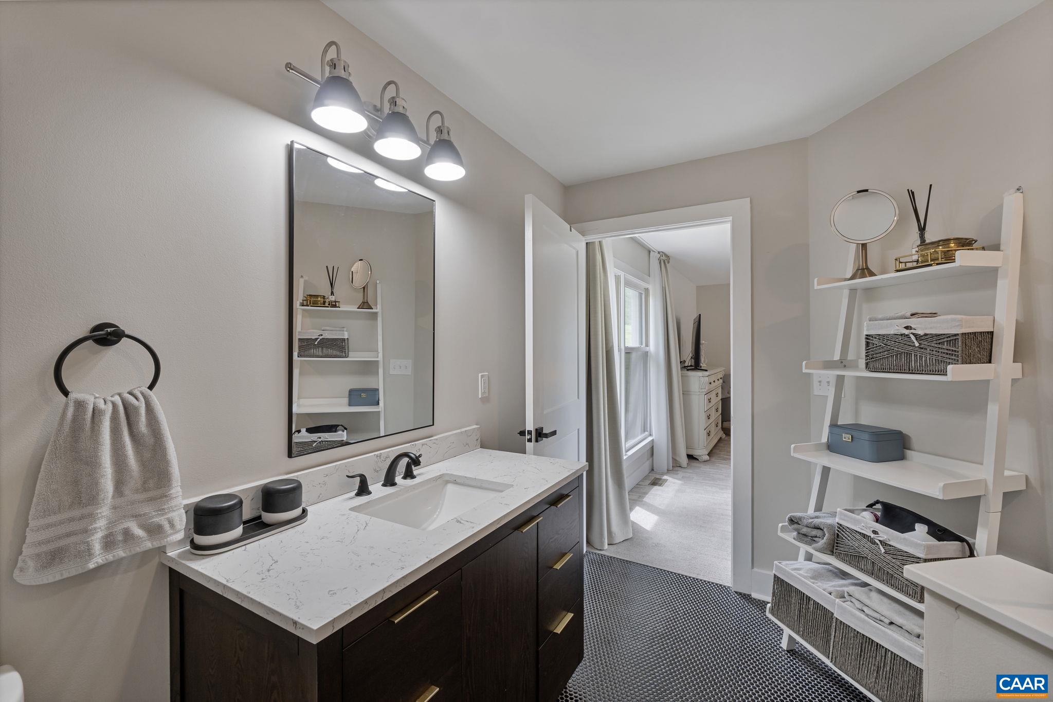 72 Daddy Rabbit Court Ruckersville, VA 22968 - Photo 44 of 71 a bathroom with a sink a vanity and a mirror