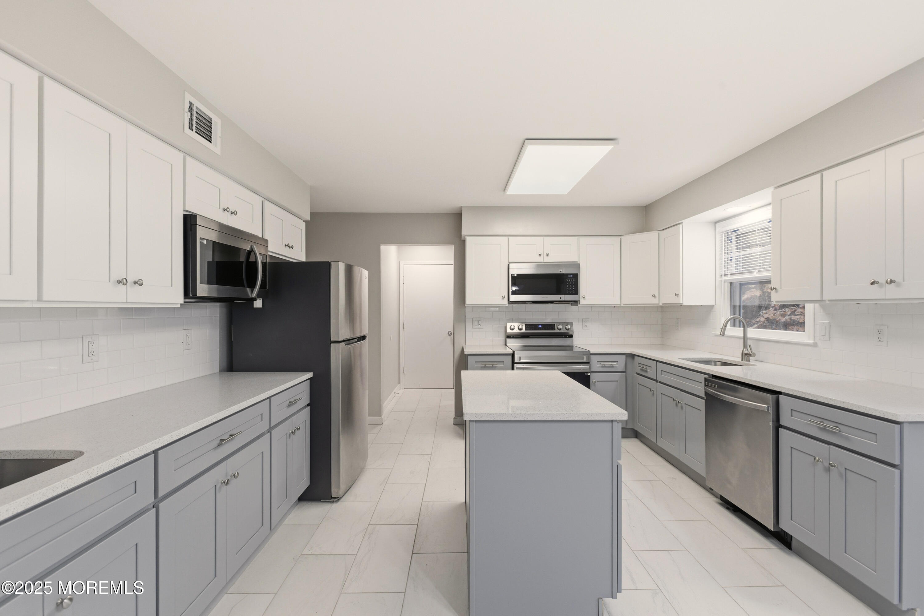 683 Anderson Road Jackson, NJ 08527 - Photo 7 of 10 a kitchen with stainless steel appliances a sink dishwasher stove refrigerator and microwave