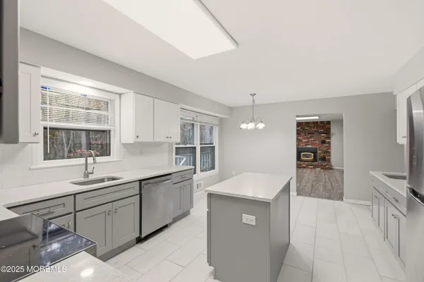 a kitchen with a sink and cabinets