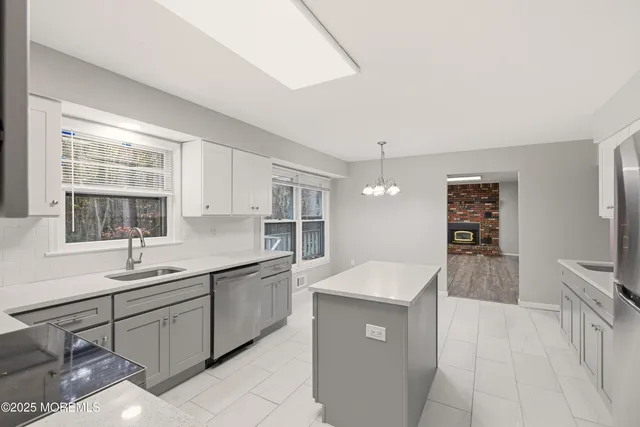 a kitchen with a sink and cabinets