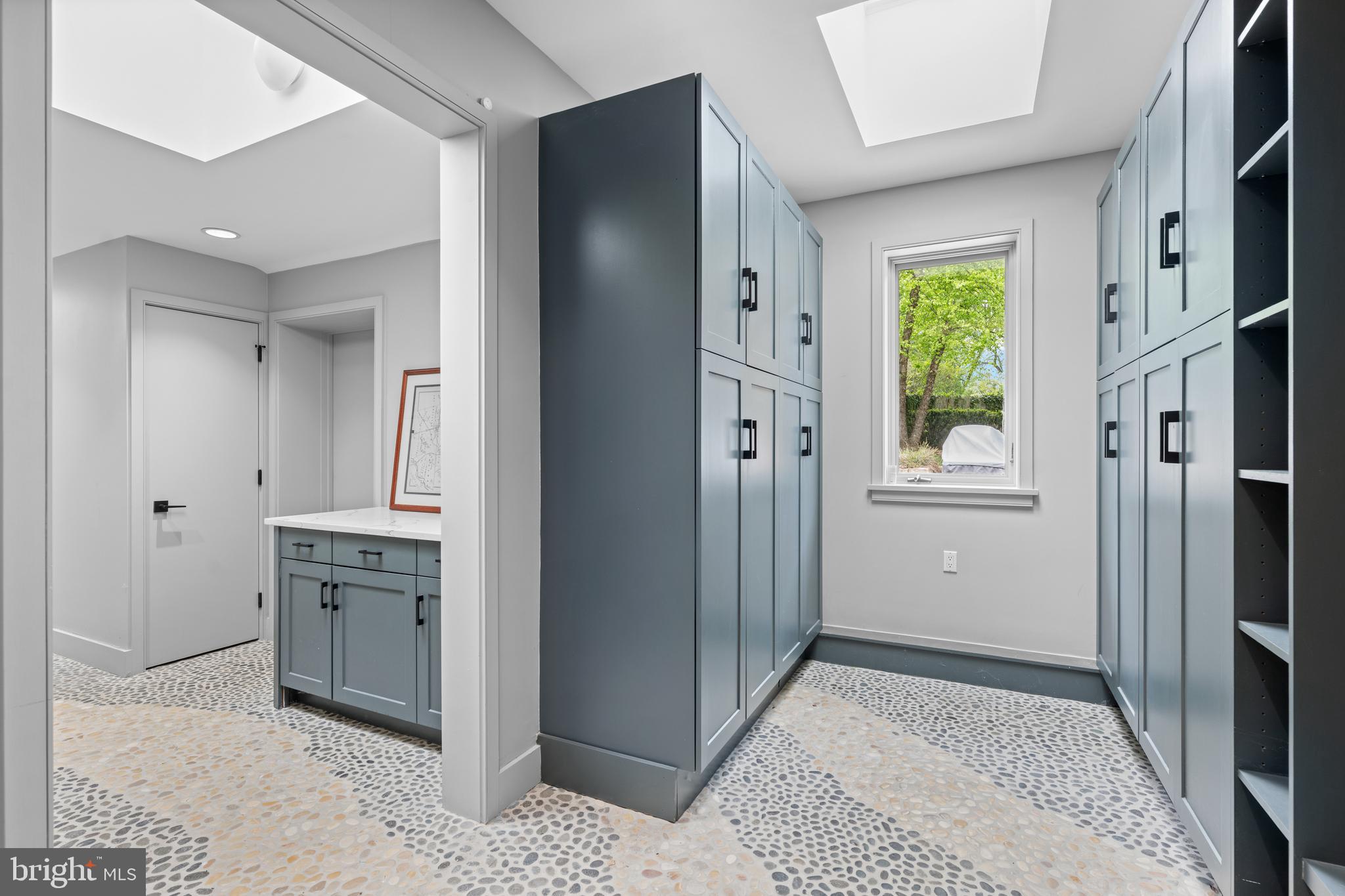 850 Lesley Road Villanova, PA 19085 - Photo 12 of 37 a view of a kitchen with a sink and a refrigerator