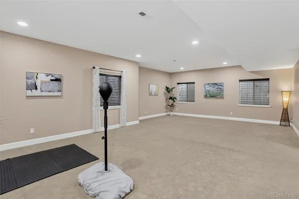 a view of a livingroom with furniture cabinet and workspace