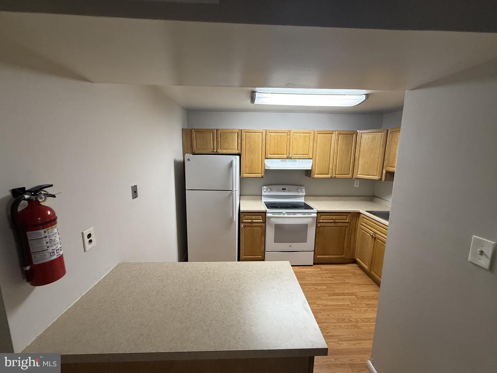 326 Saybrook Lane Wallingford, PA 19086 - Photo 5 of 17 Modern kitchen with warm wood tones.