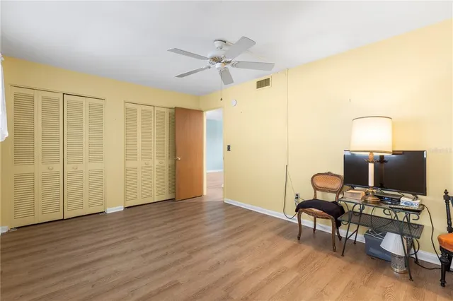a view of workspace with wooden floor windows