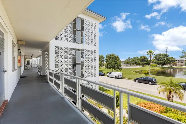 a view of a balcony with chairs