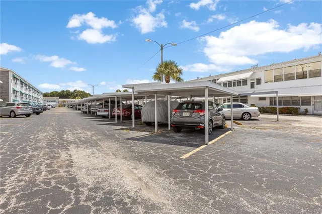 an aerial view of a swimming pool patio and lake view