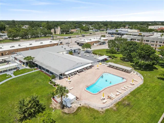 a view of a swimming pool with a yard