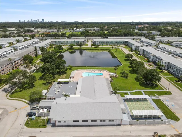 an aerial view of a house with a swimming pool