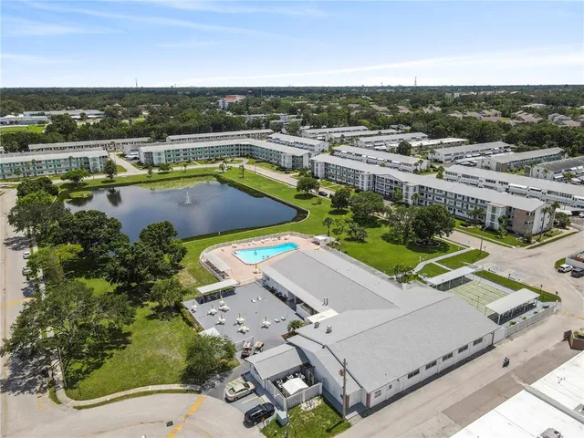 an aerial view of a house with a swimming pool