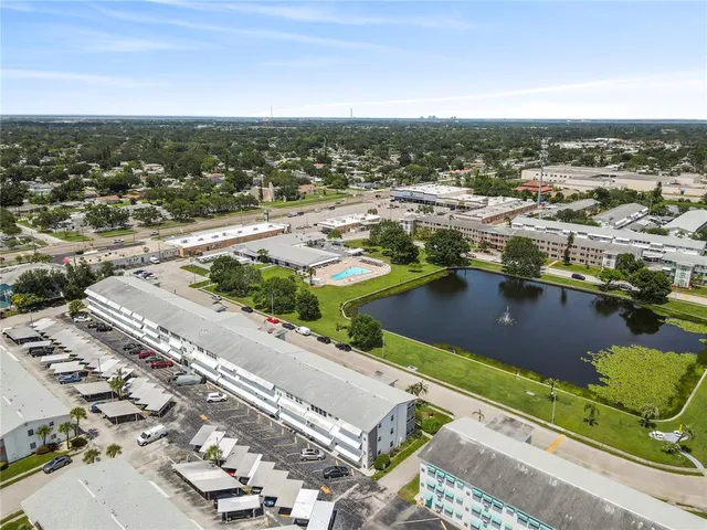a view of a lake with a couple of cars parked in front of it