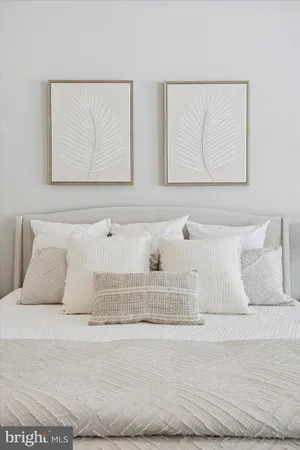 a spacious bedroom with a bed and furniture