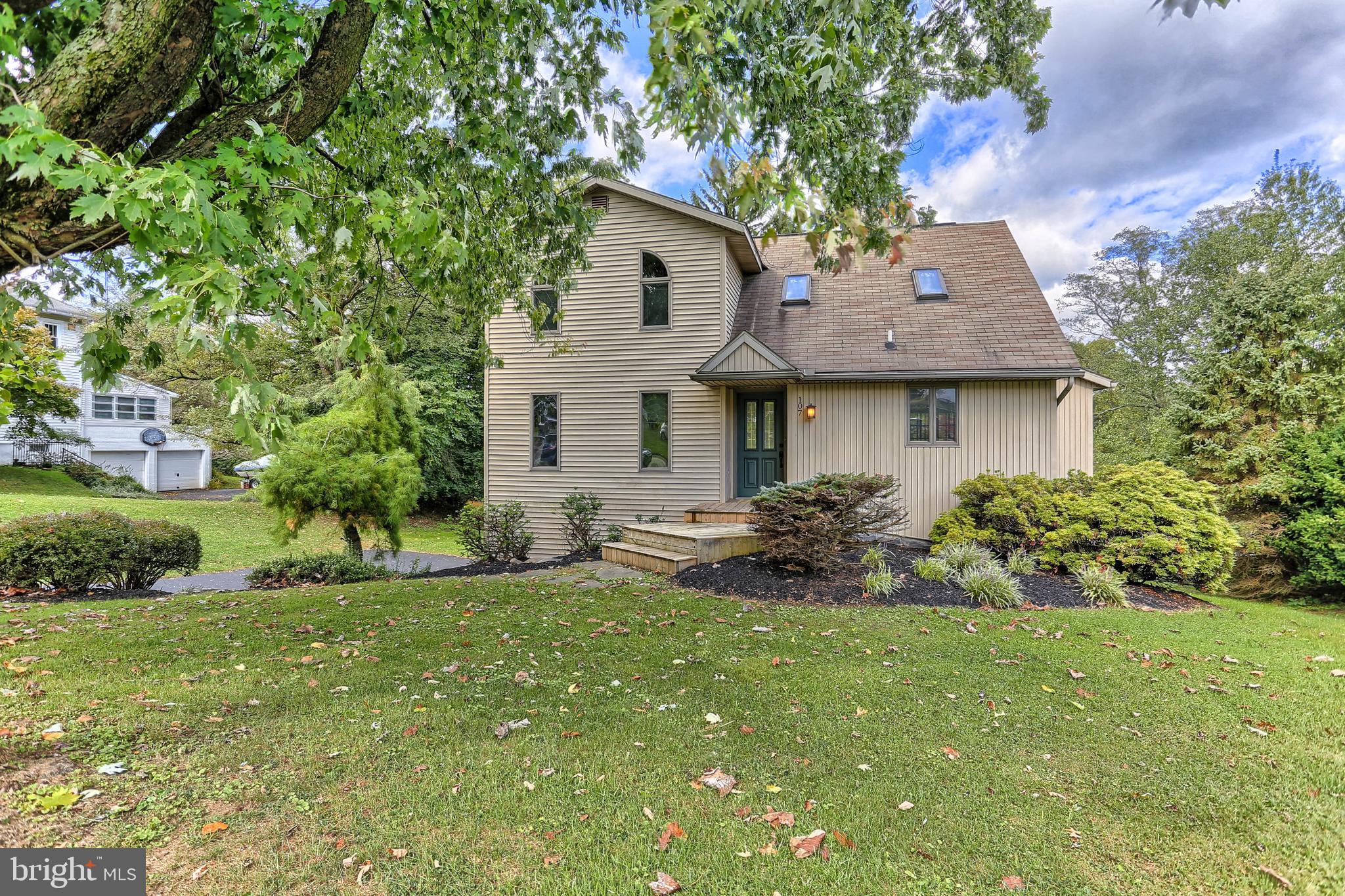 107 Winterstown Road Red Lion, PA 17356 - Photo 2 of 37 a front view of a house with a yard and garage