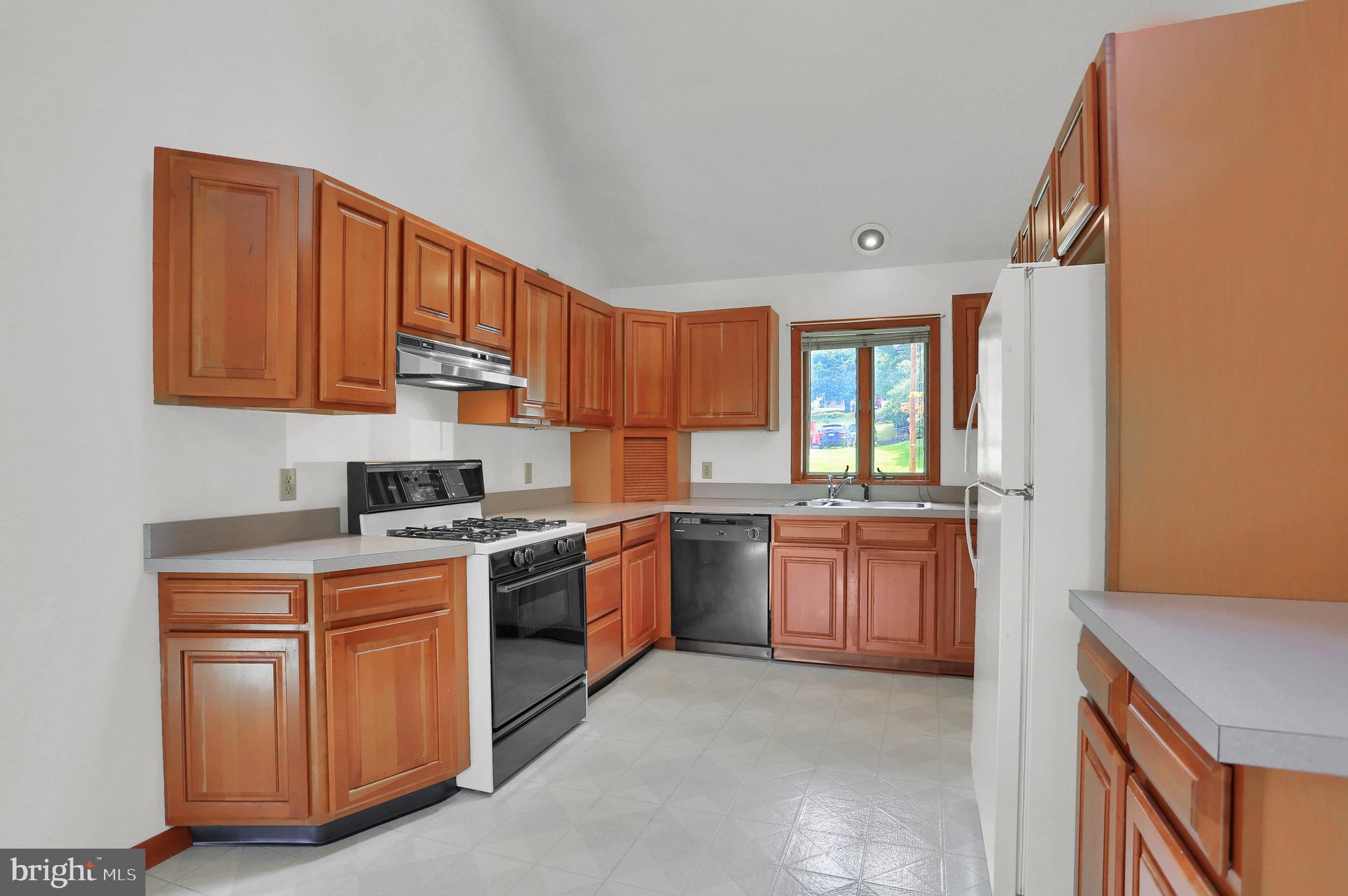 107 Winterstown Road Red Lion, PA 17356 - Photo 20 of 37 a kitchen with a stove top oven sink and cabinets