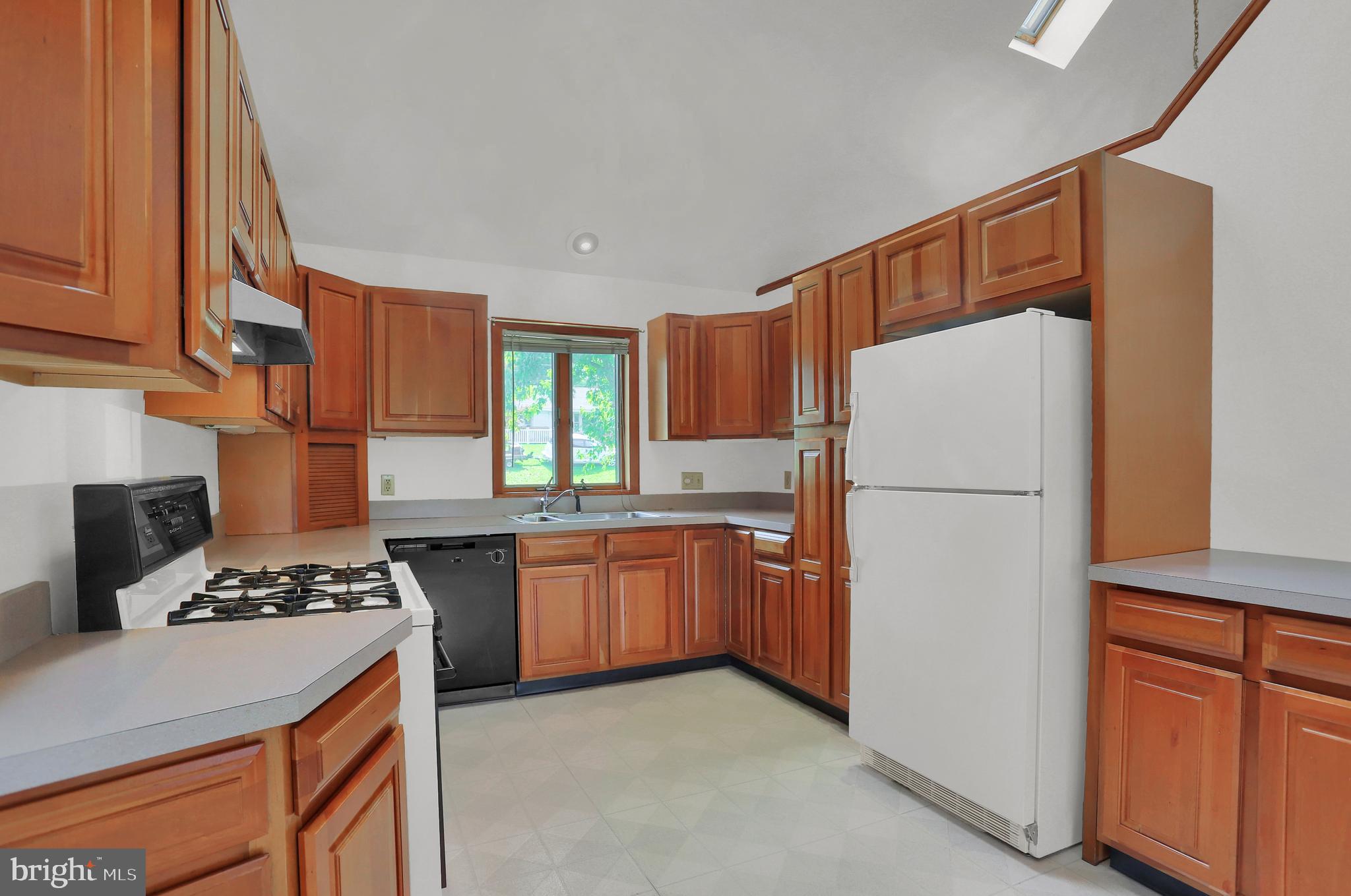 107 Winterstown Road Red Lion, PA 17356 - Photo 21 of 37 a kitchen with stainless steel appliances granite countertop a refrigerator stove and a sink