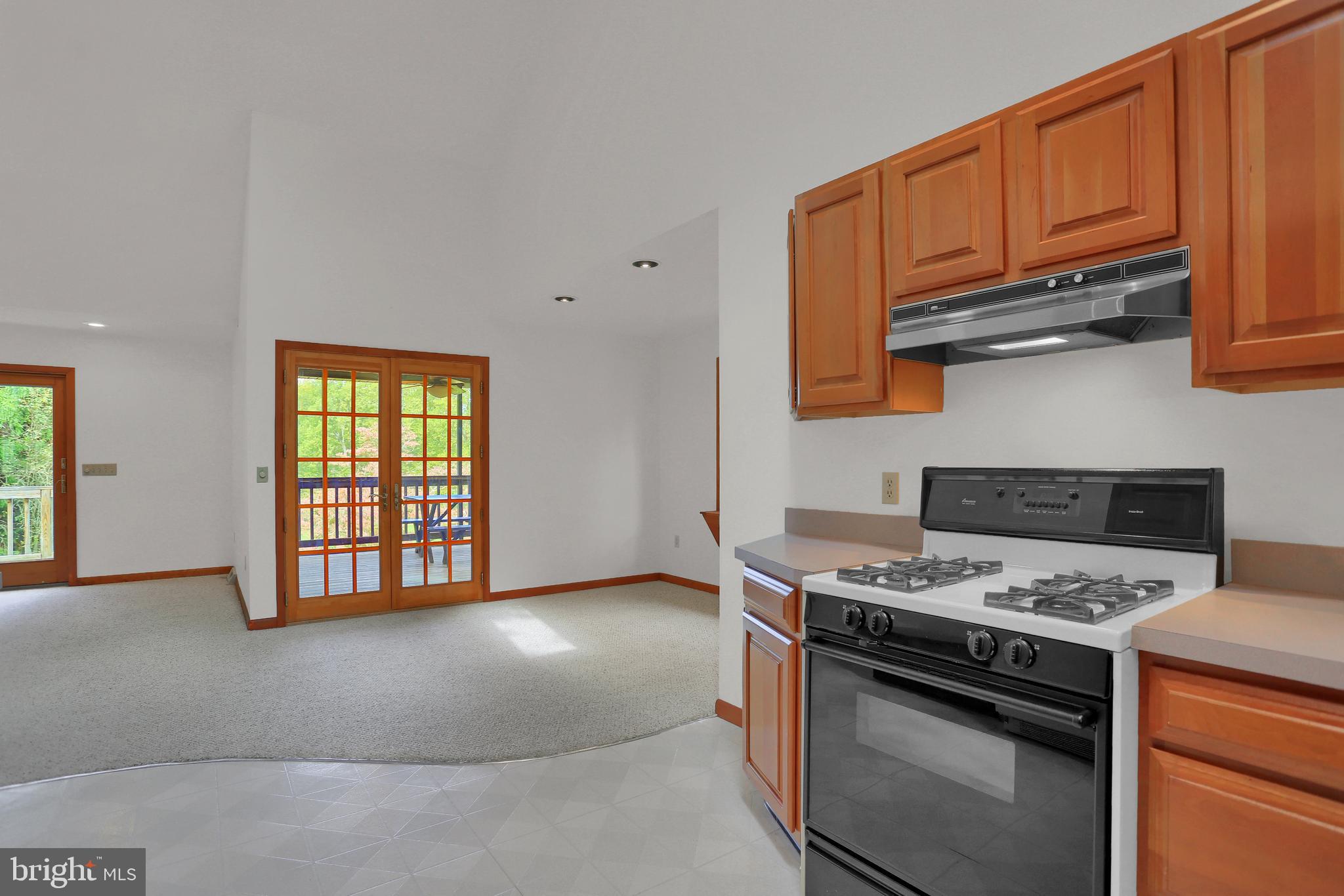 107 Winterstown Road Red Lion, PA 17356 - Photo 23 of 37 a kitchen with stainless steel appliances granite countertop a stove a sink and a microwave