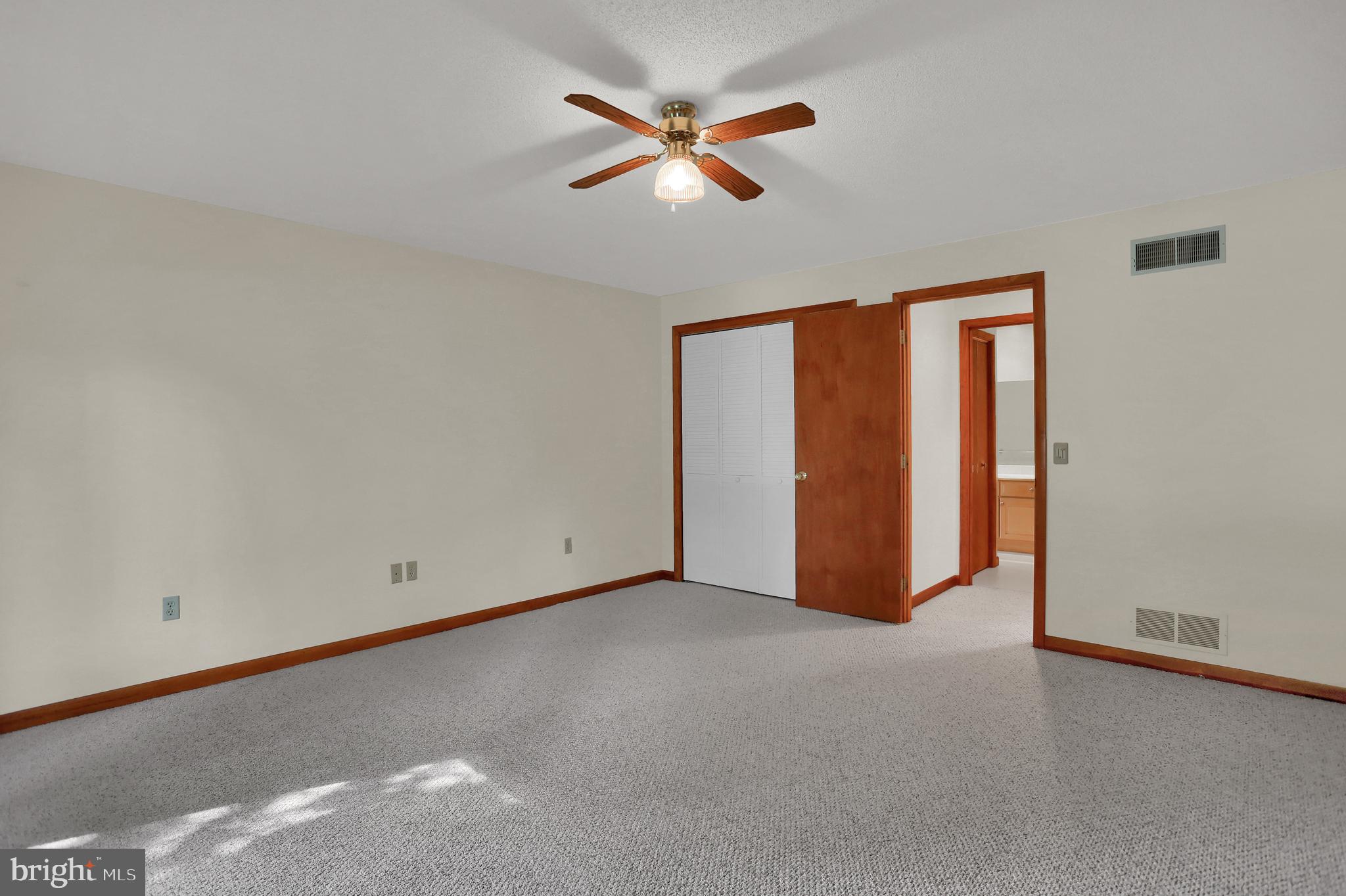 107 Winterstown Road Red Lion, PA 17356 - Photo 27 of 37 an empty room with closet and fan