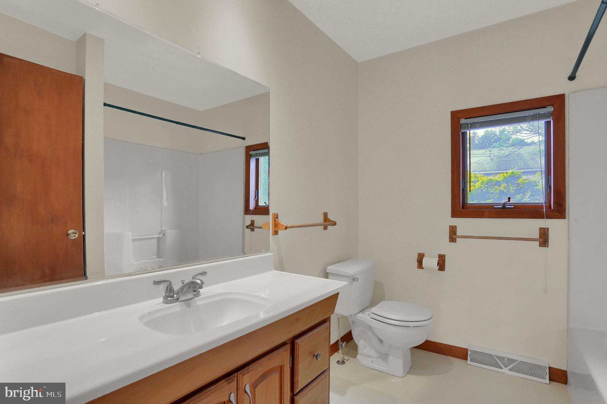 107 Winterstown Road Red Lion, PA 17356 - Photo 34 of 37 a bathroom with a toilet a sink and mirror