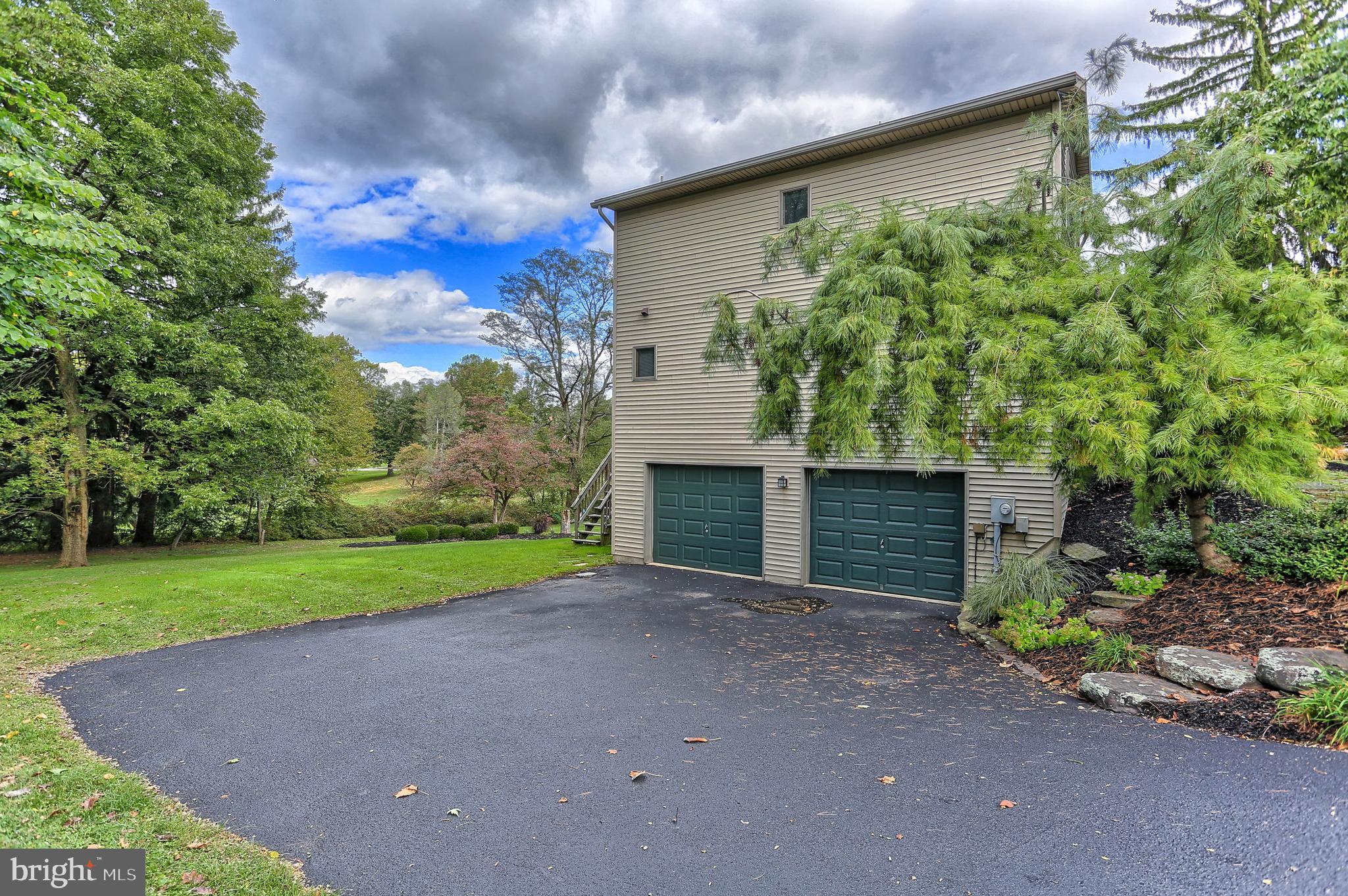 107 Winterstown Road Red Lion, PA 17356 - Photo 5 of 37 a view of a house with a yard and garage