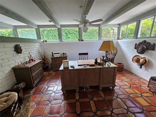 a view of a livingroom with furniture and a table