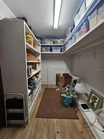 a kitchen with a table chairs stove and cabinets