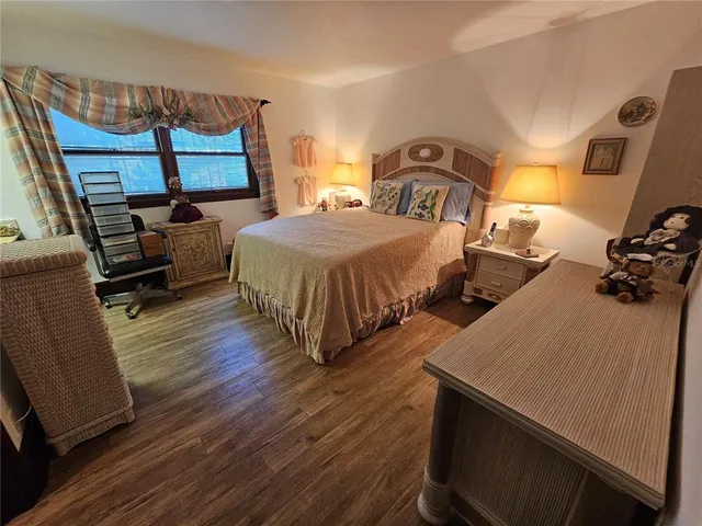 a bathroom with a toilet and a mirror