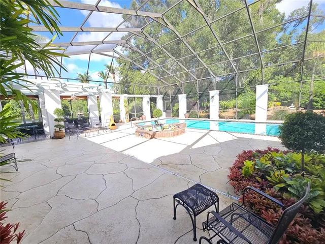 a view of a house with a yard and pathway