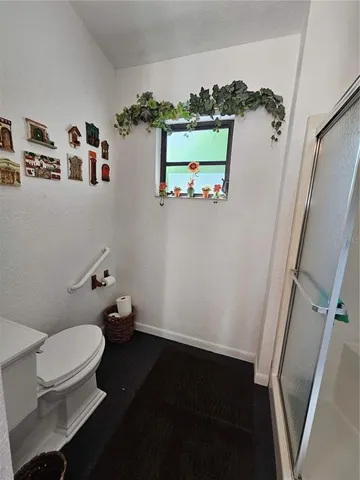 a view of a house with a wooden deck