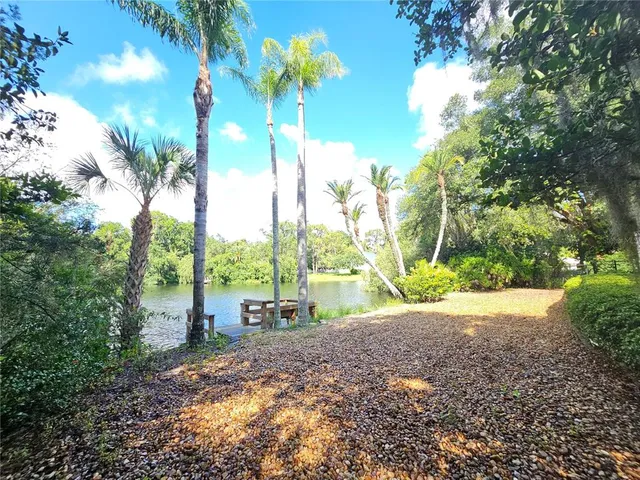 an aerial view of a house with a yard and garden