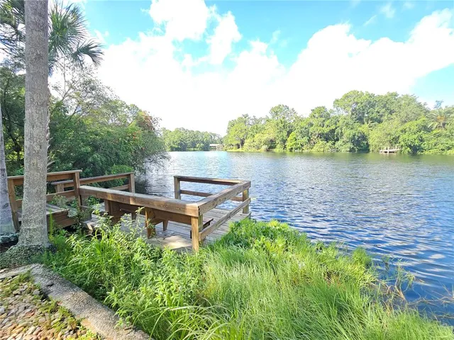 a view of house with outdoor space and sitting area