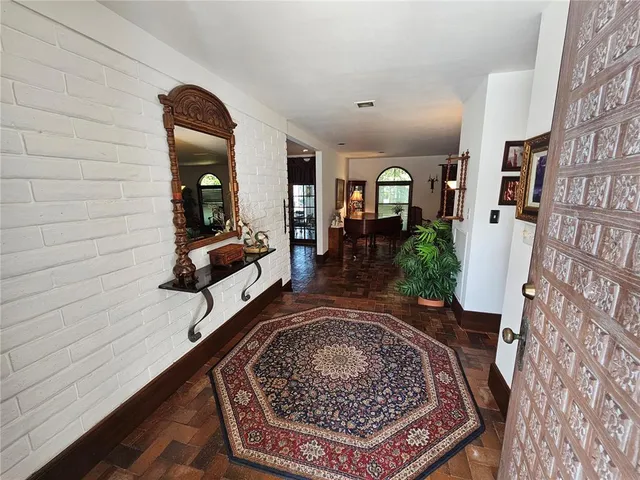 a view of a livingroom with furniture and a window