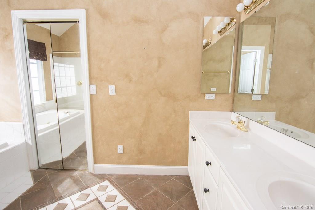 3434 Blue Jay Pass Fort Mill, SC 29708 - Photo 14 of 24 a bathroom with a sink and a mirror