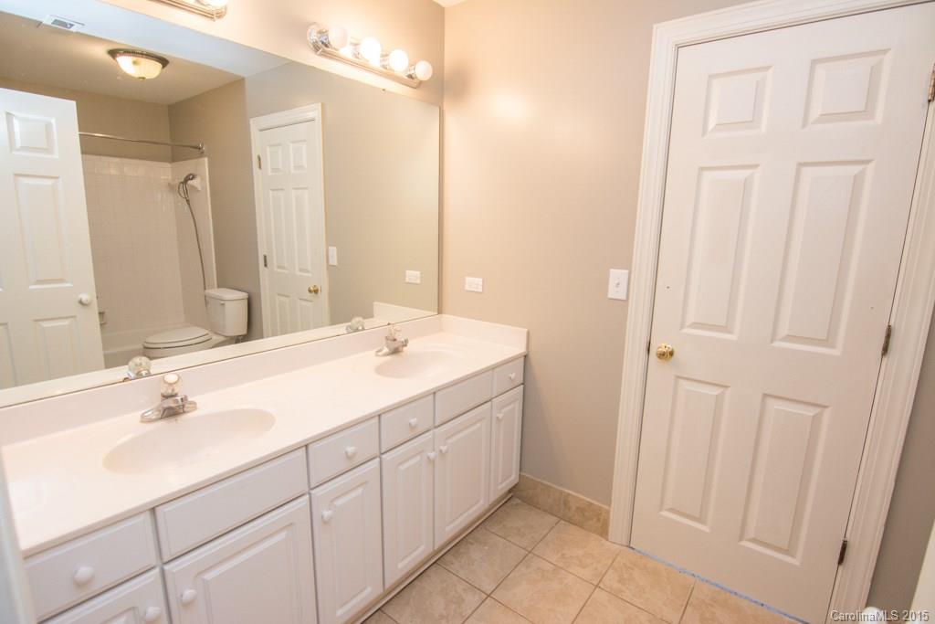 3434 Blue Jay Pass Fort Mill, SC 29708 - Photo 17 of 24 a bathroom with a double vanity sink and a mirror