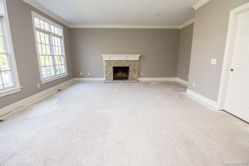 3434 Blue Jay Pass Fort Mill, SC 29708 - Photo 7 of 24 an empty room with windows and fireplace
