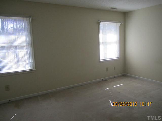 7615 Ladden Court Raleigh, NC 27615 - Photo 14 of 19 an empty room with windows