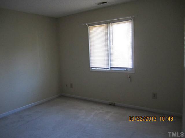 7615 Ladden Court Raleigh, NC 27615 - Photo 19 of 19 an empty room with a window