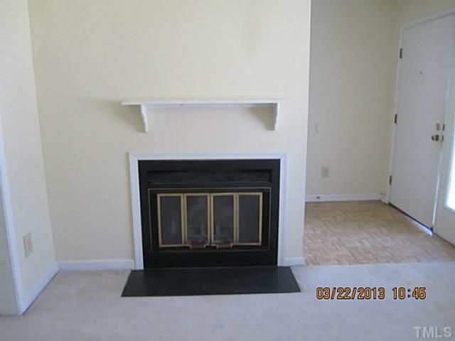 7615 Ladden Court Raleigh, NC 27615 - Photo 5 of 19 a living room with a fireplace