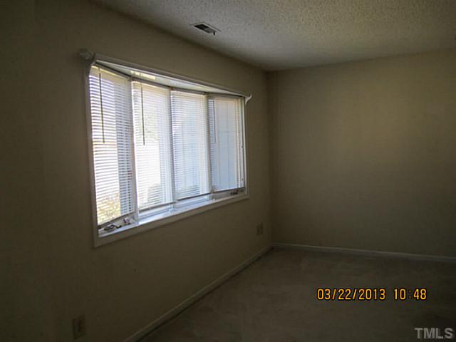 7615 Ladden Court Raleigh, NC 27615 - Photo 6 of 19 an empty room with a window