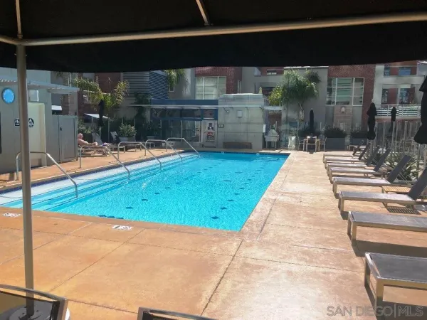 a glass door with outdoor seating