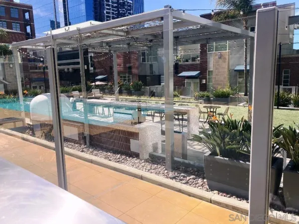 a view of a patio with table and chairs