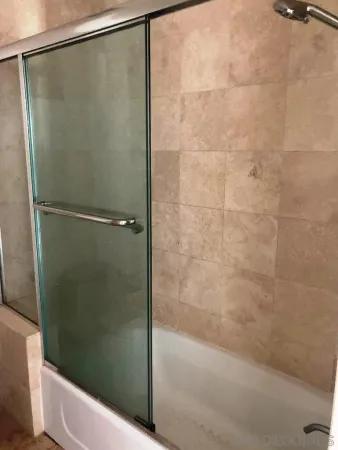 a bathroom with a shower and a toilet